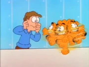 Drive Me Crazy!: Garfield spins rapidly as Jon slowly loses his sanity while watching his cat.