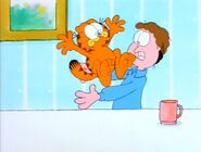 and leaps into Jon's arms.