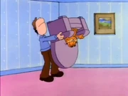 It's My Chair!: Jon shakes the chair, hoping to get Garfield out of it.