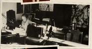 An early photo of Jim Davis working, with a set of sketches of Garfield's redesign behind him. From Garfield at 25: In Dog Years I'd Be Dead.