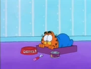 Assembly Dinner: Garfield looks at the dinner Jon prepared for him, using  barely any effort.