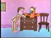 Drawer Fun: Garfield pops out of the dresser drawer to scare Jon.