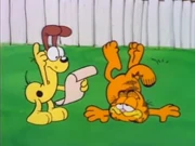 Diving Board: Garfield lies in a crumpled heap after a dive off the diving board went awry.