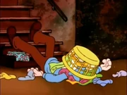 Cellar Door: Jon lies covered in laundry after Garfield slammed the door in his face.