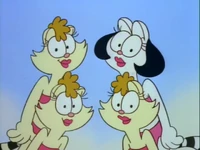 Tina is the one with white fur and black hairdo.