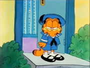 Doggy Coat: After mocking Odie and his doggy outfit, Garfield is sent out in his own humiliating garb.