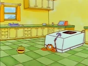 Raisin Cookies: Garfield crawls out from under the fridge after an attempt to get the cookie jar went haywire.