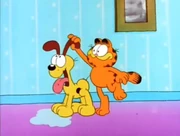 Drip: Garfield stops Odie's dripping saliva by twisting his ear like a tap.