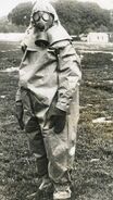 A soldier wearing a T.35 and a chemical suit