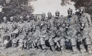 Lithuanian soldiers during a gas drill posing with Italian chemical suits and A.D.35 gas masks equipped with training filters.