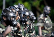 Comoran soldiers wearing MF-12 without filter during a military training on March 17, 2008 in Fomboni, the capital of Moheli.