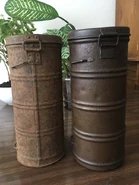 1st (left) and 2nd (right) variants A.D.35 tins displayed side by side.