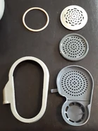 Parts2.jpg (3.95 MB) M10M voice diaphragm and covers disassembled. Rear view.