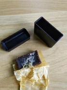 A typical example of the anti-fog soap in a Bakelite tub