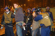 Budapest, 24th of October, 2006 Police arrests protesters at Ferenciek Square. Note the 70M bags and the Biomaszk with Respirátor industrial filter hanging from the neck of the middle policeman.