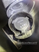 A look at the actual E17R1 outlet-valve on the E51R15. it is a 2-piece valve that is operated by exhaled air pushing out the slits in the side of the valve.