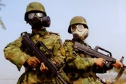 Queshan-2006 actual military exercise, one person wears FMJ05 gas mask and the other wears Type 65 gas mask