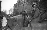 Légoltalmi liga worker on a 3 wheel car in Budapest.