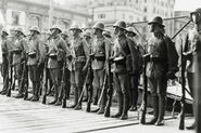 The carrier bag of the mask can be seen on the hip of the soldiers, Shanghai 1937