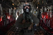 U.S. Air Force Staff Sgt. Stephen Lail, 19th Operations Support Squadron loadmaster, tests the water tube of the XM69 Joint Service Aircrew Mask Strategic Aircraft during operational testing of the new system at Little Rock Air Force Base, Arkansas, April 26, 2019. (U.S. Air Force photo by Senior Airman Rhett Isbell)