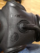 Bottom view of stamp marking and base of drinking straw, moved side to side to control straw inside mask