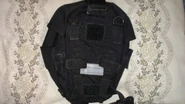 Rear view of the gas mask pouch with MOLLE webbing attachment points visible.