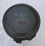 This type of marking would usually be found on the tin. This precise tin belongs to a reused GM38, however is similar in marking.