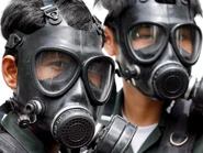 Riot police wear gas masks in Bangkok, Thailand. PHOTOGRAPH BY EPA/CORBIS