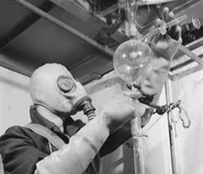 Worker using the mask at Reanal Finomvegyszergyár, Budapest 1961.