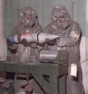 M9A1 Gas Masks With Toxicological Agent Protective (T.A.P.) Hoods And Aprons.jpg (122 KB) Chemical Munitions Handlers wearing M9 Masks with M3 TAP Hoods and M2 TAP Aprons.