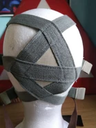 Photo of the DM-1 head-harness, note the textured pull tabs