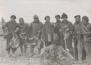 Soldiers showing captured Italian gas masks during the Spanish civil war. The first gas mask on the right is a Penna with an M33 kit