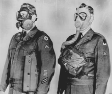 An M9 Field Protective Mask with early C48R1 Facepiece (Left) compared to the older M3-10A1-6 Lightweight Service Mask. Notice the later pull-tab on the C15 Exhale Valve.