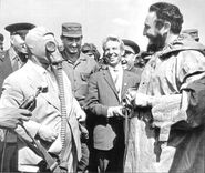 Nikita Khrushchev wearing an ShM-41 and Fidel Castro wearing an OZK chemical suit.