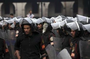 Egyptian police use SzM41M masks during protests in 2011.