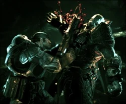 The Lancer's chainsaw cutting through a Theron Guard.