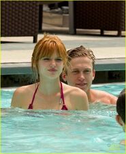 Bella-thorne-pink-bikini-with-boyfriend-in-the-pool