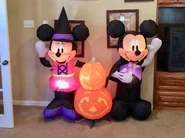 Witch Minnie and Vampire Mickey Mouse with Pumpkins