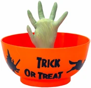 Hand Candy Bowl-Witch Hand In Orange Candy Bowl With “Trick Or Treat” Text And Witch Related Pictures