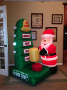 Gemmy animated inflatable santa at holiday cheer meter game