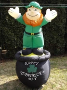 Leprechaun standing on pot of gold