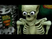 To the left of Wisecrack Jack hangs a Mr. Bone Jangles with a tag calling him "Spooky Skeleton" at a store in 2008.