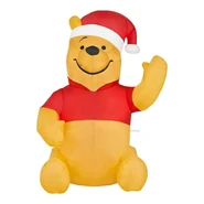 Waving Winnie the Pooh wearing Santa Hat