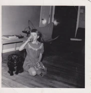 On the back of the photo printed in a child's handwriting is "My 25, 1953 sPooker Jones and Faith Jones Drinking orange Juice"