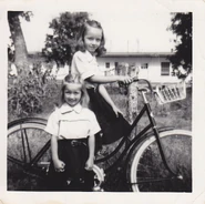 Faith and her sister Lauralee (on the bike).