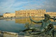 View of the Palace from the southern part of the Parterre d'Eau, with the bronze statue of the Rhône River by Jean-Baptiste Tuby (1687)