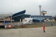 A picture of the terminal of "Târgu Mureş International Airport", as seen from the runway