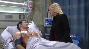 Nathan tells Maxie that he's going to be fine and that she has to leave