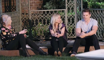 Maxie, Dustin, and Lulu enjoy a drink in the park