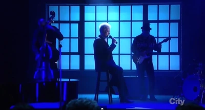 Luke sings "I Am What I Am"